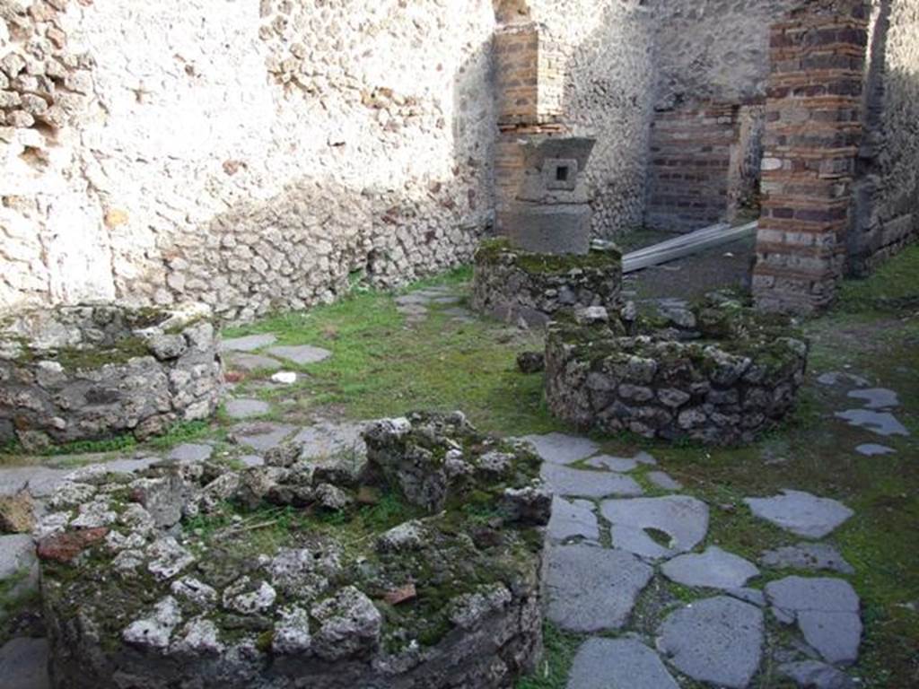 IX.5.4 Pompeii. May 2005. Bakery area with remains of four mills.
According to Eschebach, a lararium was found near the four mills.
See Eschebach, L., 1993. Gebäudeverzeichnis und Stadtplan der antiken Stadt Pompeji. Köln: Böhlau. (p.422).
According to Boyce, at the time of excavation a fragmentary sacred painting of which only one Lar with situla remained was found.
See Boyce G. K., 1937. Corpus of the Lararia of Pompeii. Rome: MAAR 14. (p.85, no.421).
According to Sogliano, remains of a sacred painting were found.
See Notizie degli Scavi di Antichità, 1878, (p.41).
See Sogliano, A., 1879. Le pitture murali campane scoverte negli anni 1867-79. Napoli: (p.19, no.70).