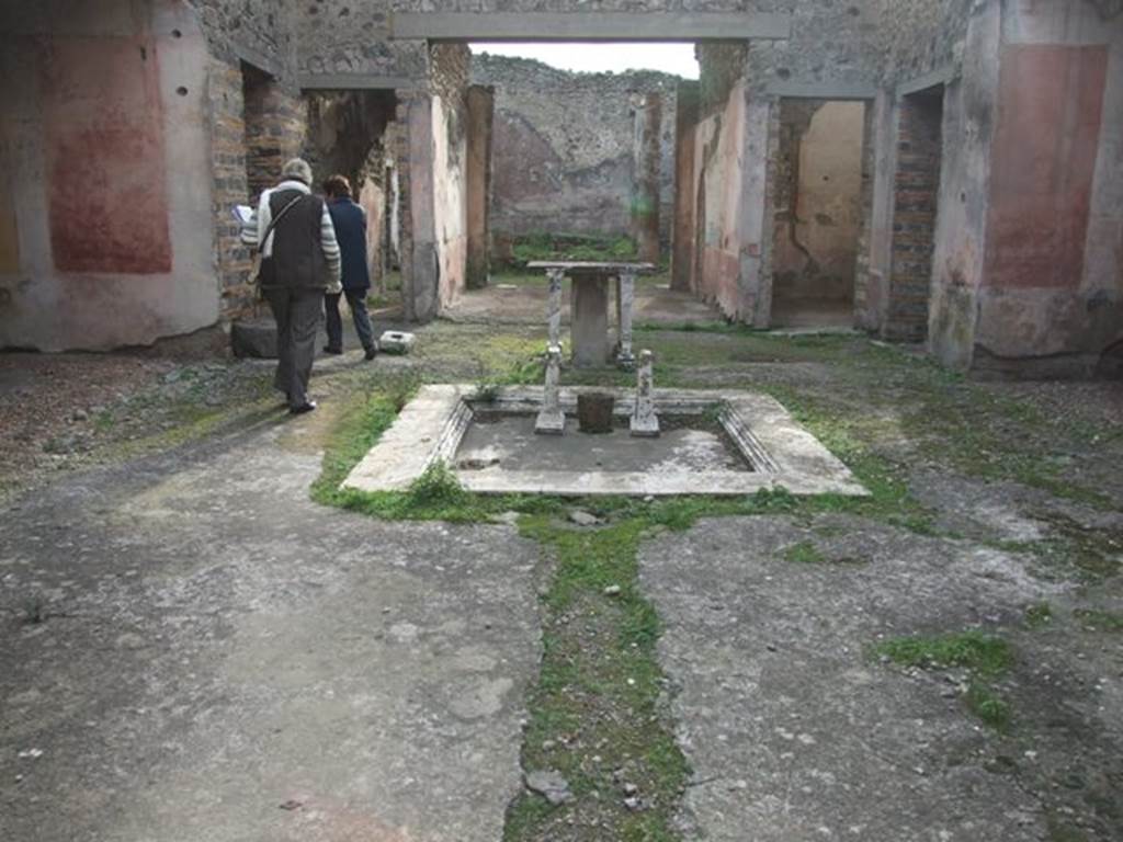 IX.5.11 Pompeii. December 2007. Room 1. Atrium. Looking south across impluvium to Tablinum.