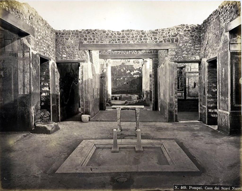 IX.5.11 Pompeii. Looking south across impluvium in atrium, towards tablinum.
Photograph No. 469, by Roberto Rive, (18..-1889) described as “Casa dei Scavi Nuovi”. Public domain, via Wikimedia Commons