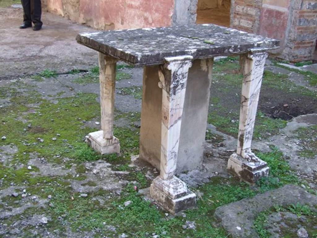 IX.5.11 Pompeii. December 2007. Room 1, marble table or cartibulum behind impluvium in atrium.