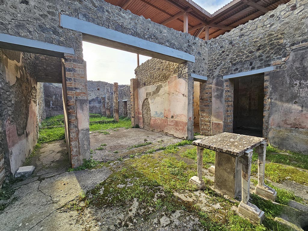 IX.5.11 Pompeii. November 2024. 
Room b, looking south from atrium through tablinum to peristyle area. Photo courtesy of Annette Haug.
