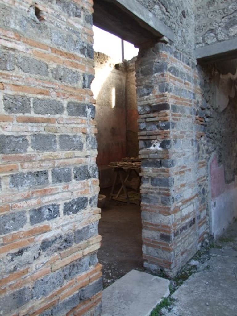IX.5.11 Pompeii. December 2007. Doorway to Room 4 and corridor to garden area.