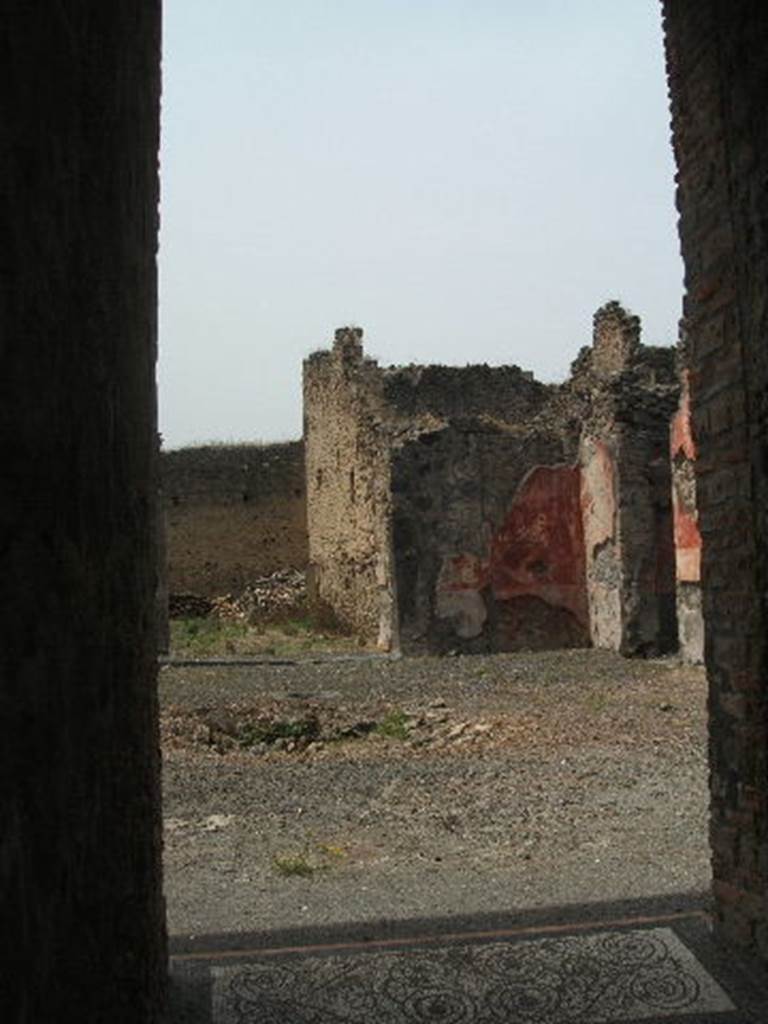 IX.5.14 Pompeii. May 2005. Looking north-west across atrium "b". The doorway to the peristyle can be seen on the left. The doorway to a triclinium can be seen on the right (not photographed) According to PPP, this room is “room f”, and found in it were the under-mentioned paintings. According to Richardson, found in triclinium “o” were the following paintings. All now in Naples Archaeological Museum.
Pyramus and Thisbe, (Naples Inventory number 111483),
Pair of men before an enthroned queen (Aeneas before Dido?) (Naples Inventory number 111480), Bacchus and Ariadne with thiasus (Naples Inventory number 111481). See Richardson, L., 2000. A Catalog of Identifiable Figure Painters of Ancient Pompeii, Herculaneum. Baltimore: John Hopkins. (p.153) See Bragantini, de Vos, Badoni, 1986. Pitture e Pavimenti di Pompei, Parte 3. Rome: ICCD.