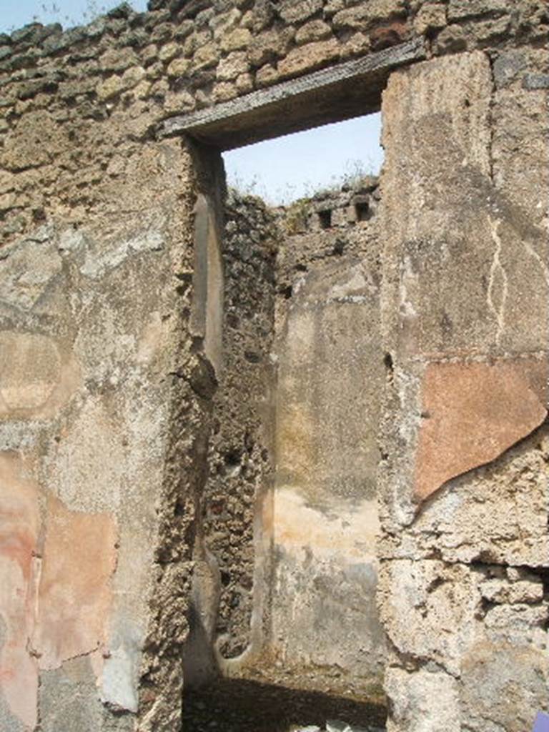 IX.6.5 Pompeii.  May 2005. Doorway to Room on north side of atrium.