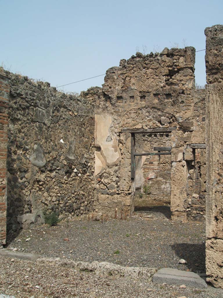 IX.6.e Pompeii. May 2005. Looking north across shop entrance.
On the left, west wall, would have been the steps to the upper floor.
In the north wall is a doorway into room “c” of IX.6.d, and a window into room “d” (see IX.6.d)
According to Mau, this was described as number 10, of IX.6.
See Bullettino dell’Instituto di Corrispondenza Archeologica (DAIR), 1881, (p.25)
See Eschebach, L., 1993. Gebäudeverzeichnis und Stadtplan der antiken Stadt Pompeji. Köln: Böhlau. (p.428)