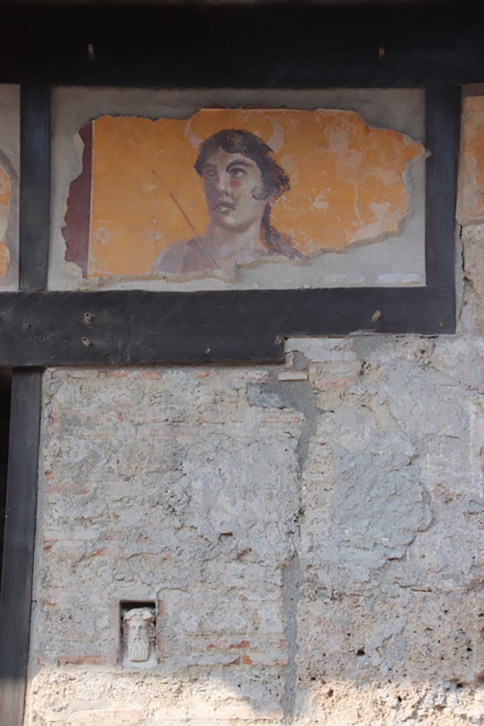 IX.7.1 Pompeii, October 2023.
East or right-hand side of entrance, with bust of Dionysus in niche. Photo courtesy of Klaus Heese.