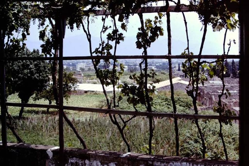 Looking east, Pompeii. 1973. View from the Casina dell’Aquila above IX.7.12 across IX.7, IX.12 (still unexcavated), towards IX.13.1-3 (with roof). Photo by Stanley A. Jashemski.
Source: The Wilhelmina and Stanley A. Jashemski archive in the University of Maryland Library, Special Collections (See collection page) and made available under the Creative Commons Attribution-Non Commercial License v.4. See Licence and use details. J73f0241