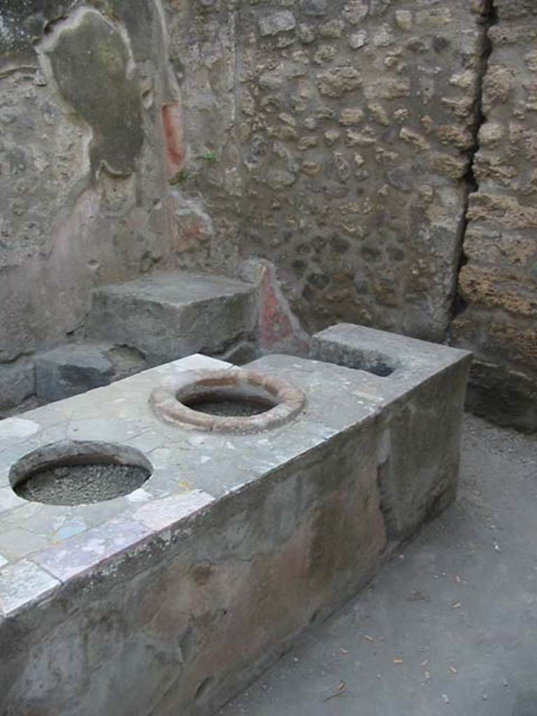 IX.7.13 Pompeii. May 2003. Looking across counter towards steps in north-west corner. Photo courtesy of Nicolas Monteix.