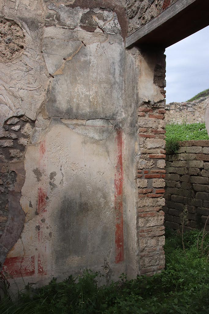 IX.7.16 Pompeii. October 2024.
Room “b”, detail of north wall at east end, with doorway into atrium. Photo courtesy of Klaus Heese.