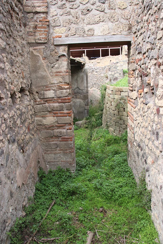 IX.7.16 Pompeii. October 2024. Room 3, looking north towards doorway to atrium.
According to Boyce, this room would have led into the kitchen.
Photo courtesy of Klaus Heese.