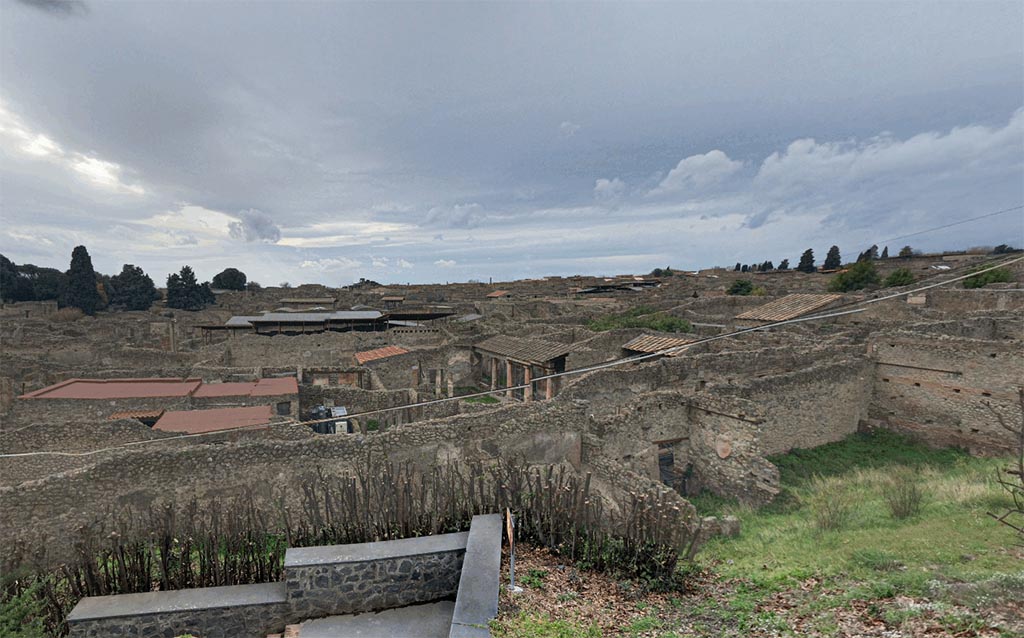 IX.7.12, 14 or 16 Pompeii. 2017.
Looking down from the Casina dell’Aquila towards an aedicula lararium in the north-west corner of the garden area “e” , on the right in the photo.
Photo courtesy of Google Earth.
Due to the fact that the area has not been fully excavated, it is not known whether the garden area belongs to IX.7.12, 14 or IX.7.16.