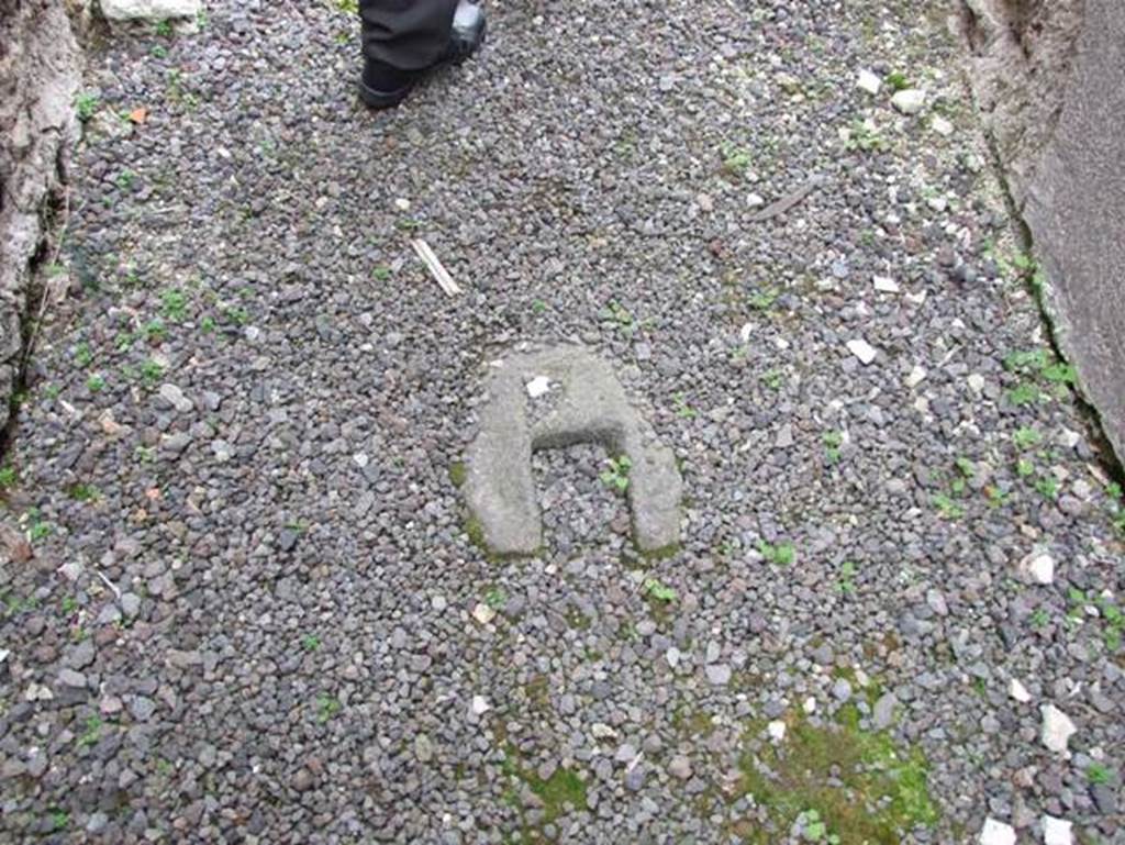 IX.7.20 Pompeii. December 2007. Stone entrance door stop.