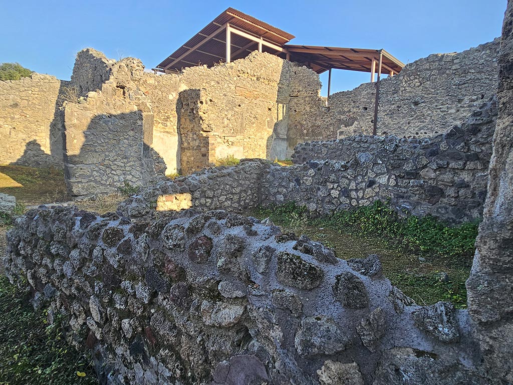 IX.7.21 Pompeii. November 2024. Looking across rooms on south side of entrance doorway. Photo courtesy of Annette Haug.