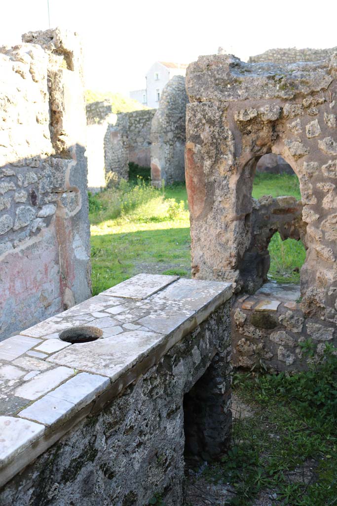 IX.7.24 Pompeii. December 2018.
Looking south-east towards rear of counter, and south wall. Photo courtesy of Aude Durand.