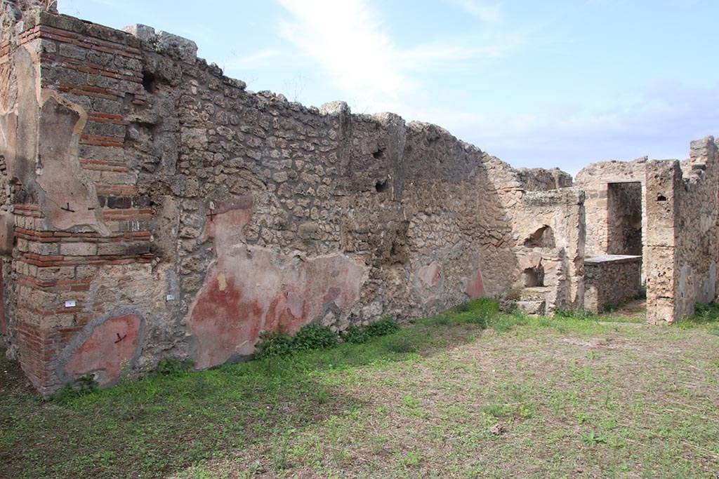 IX.7.25 Pompeii. October 2024. Looking north along west wall of atrium. Photo courtesy of Klaus Heese.