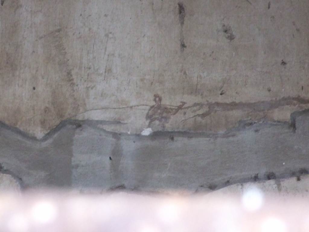 IX.8.6 Pompeii. March 2009. Room 57, remains of painting of figure on north wall in white triclinium.