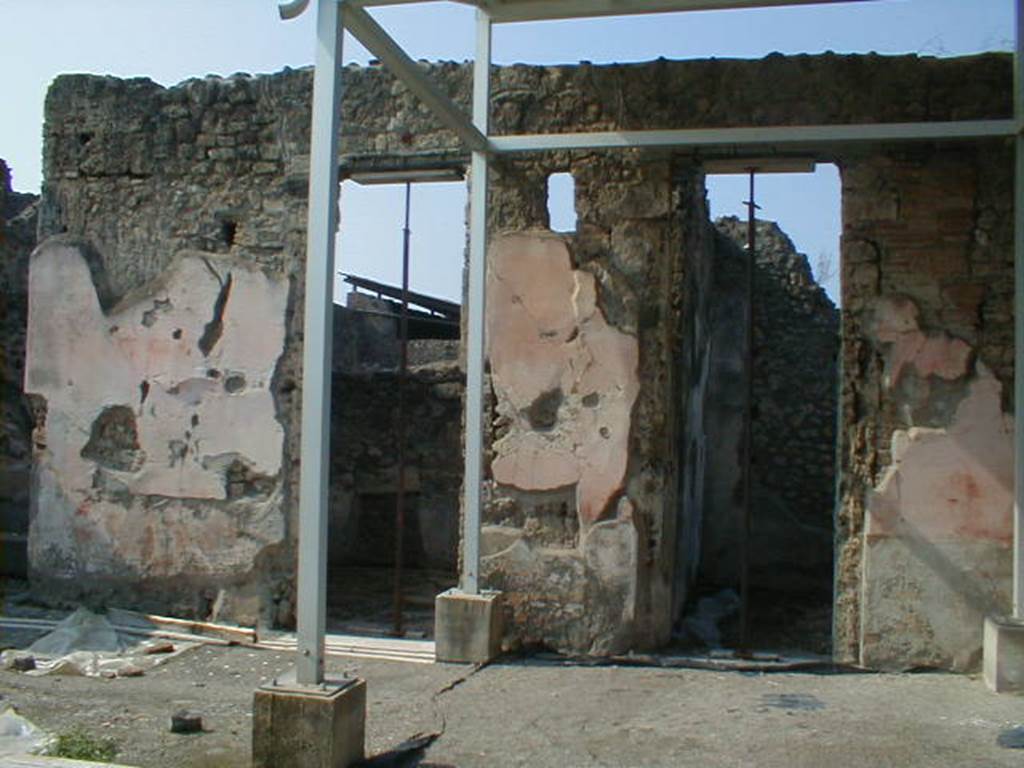 IX.8.6 Pompeii. September 2004. Doorways to Rooms 7 and 6 on west side of atrium.