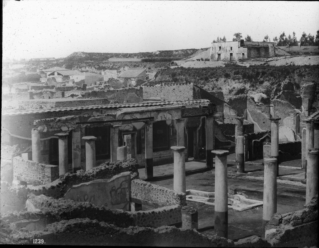 IX.8.6 Pompeii. c.1880s? no. 1239 presumably taken by G. Sommer, as above photo.
Looking north-west across the peristyle from outside and above the exterior wall.
Photo by permission of the Institute of Archaeology, University of Oxford. File name instarchbx208im 117. Resource ID. 44442.
See photo on University of Oxford HEIR database