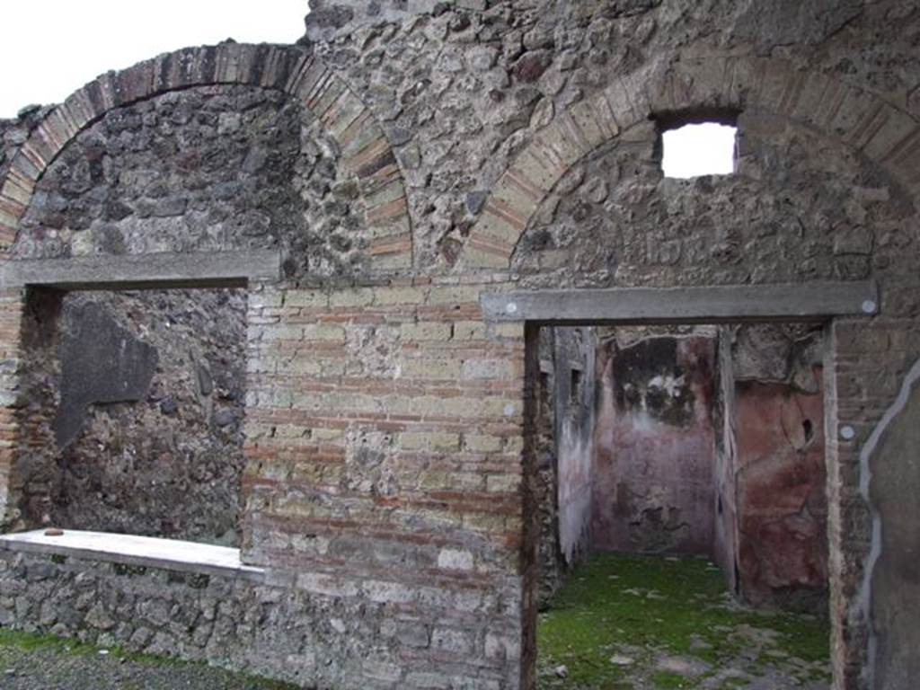 IX.8.6 Pompeii. March 2009. Doorway to Room 20, window to Room 21, and south wall of Portico.
