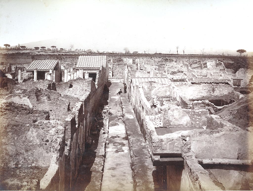 IX.8.8 Pompeii, on left. Undated photo by Sommer numbered 1298.
Looking north along unnamed vicolo between IX.8 on left and IX.9 on right, with ongoing work taking place in the vicolo.
Photo courtesy of Espen B. Andersson.