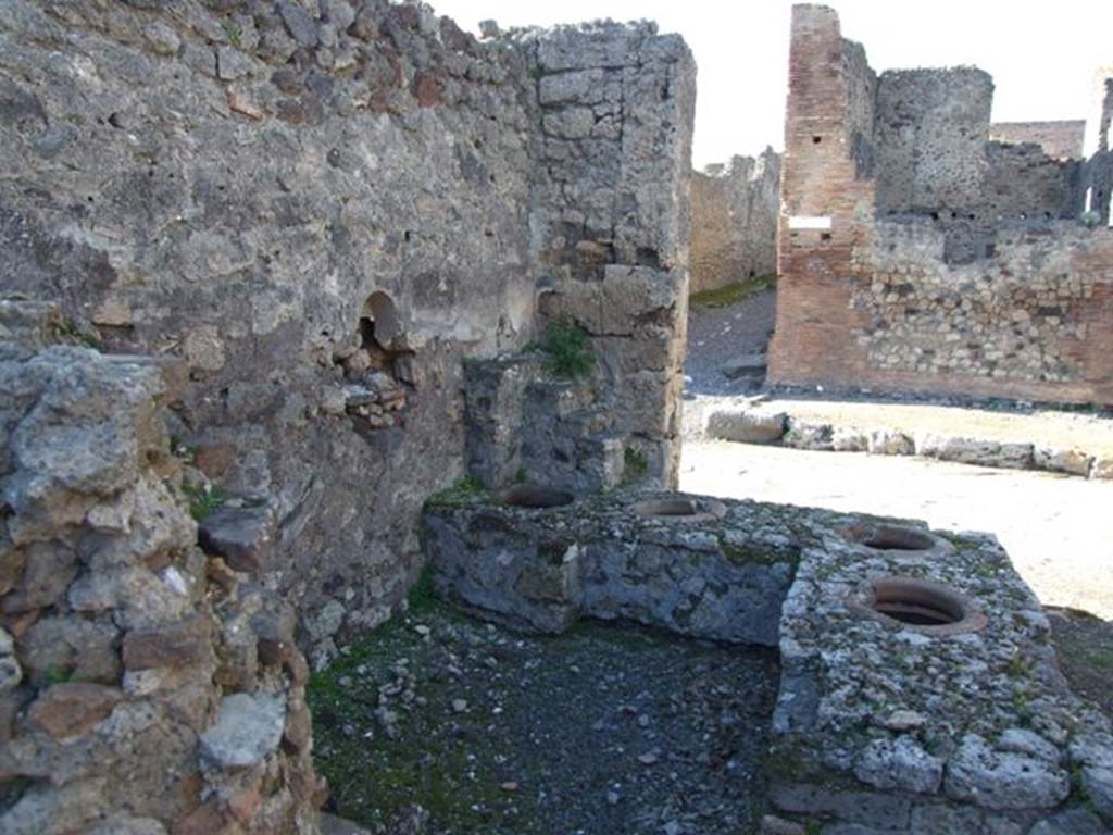 IX.9.1 Pompeii. March 2009. Looking north at counter area, from rear.