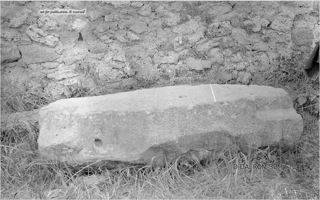 IX.9.6/10 Pompeii. Chest base.
According to Pernice –
Found in front of the un-plastered long wall of the large courtyard.
The base was probably in place before the building was remodelled, but due to its weight it was simply left lying there and used for something else.
No traces of rust can be found on the surface. The notches indicate square feet. The iron spike and the hole that are typical for money box foundations are missing.
See Pernice, E., 1932. Hellenistische Tische, Zisternenmündungen, Beckenuntersätze, Altäre u. Truhen. Berlin, p. 73, Taf. 43.5.
DAIR 32.1112. Photo © Deutsches Archäologisches Institut, Abteilung Rom, Arkiv.
Thanks to Espen B. Andersson for assisting us in our interest in money-chests.