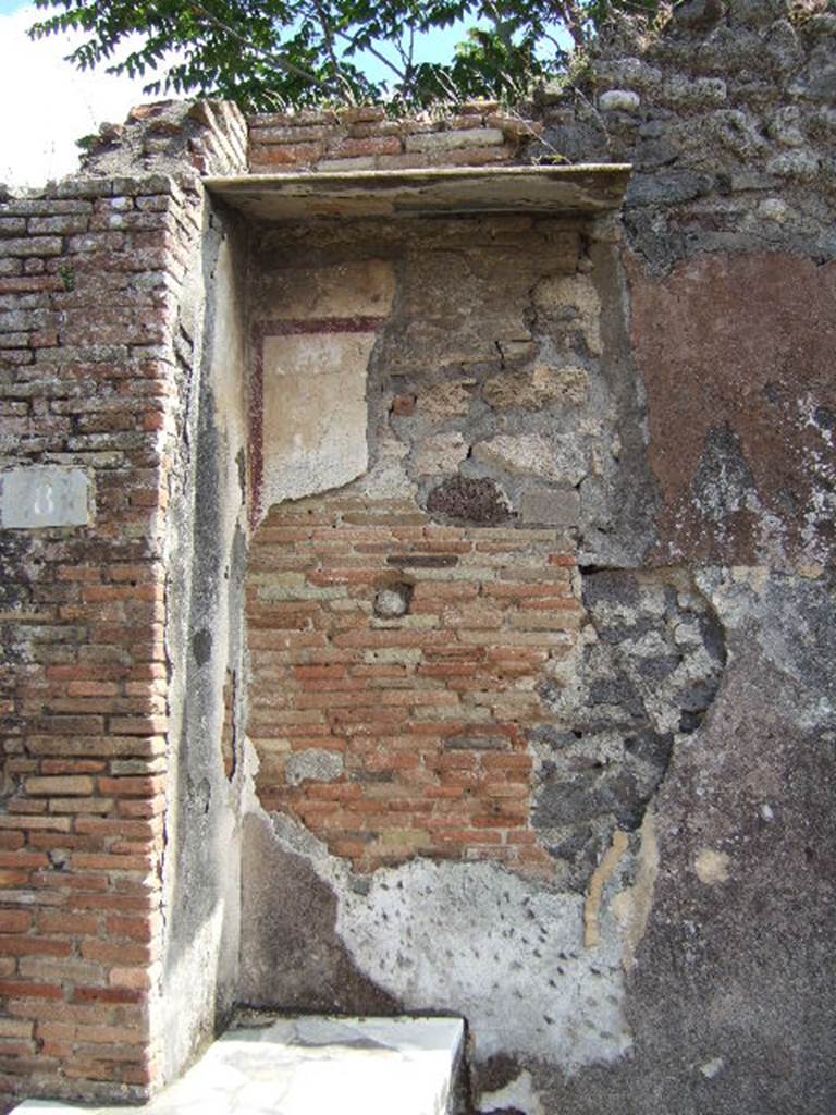 IX.9.8 Pompeii. May 2006. East wall behind counter.