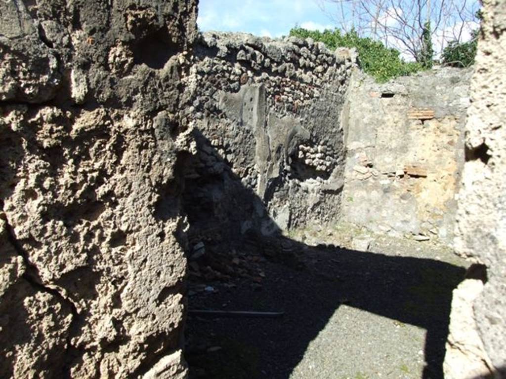 IX.9.12 Pompeii. March 2009. Doorway to Room 15, Kitchen. Looking east from Room 16, the Light-yard.