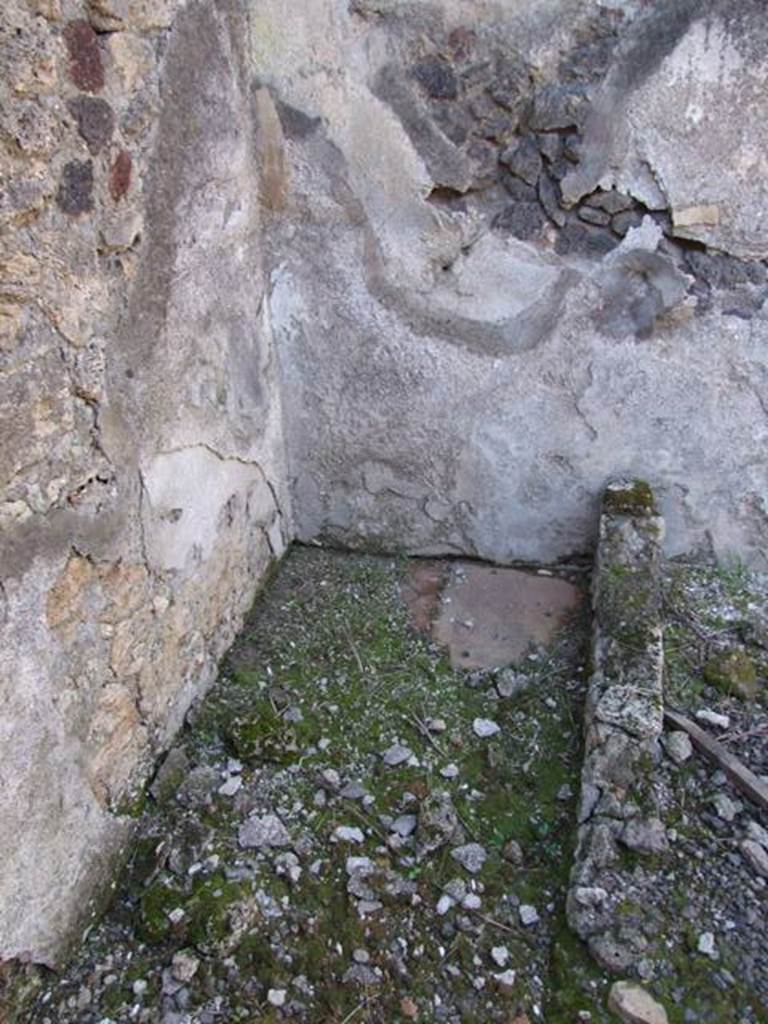IX.9.12 Pompeii. March 2009. Room 15, north-west corner of kitchen. According to NdS, another puteal above a cistern-mouth was found in this area next to the doorway from the light-yard. The water entered it from a type of small impluvium, which collected the water from the roof.