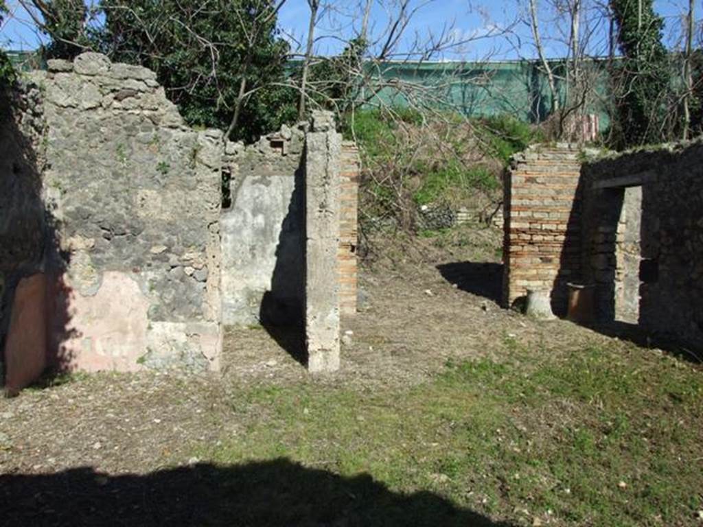 IX.9.12 Pompeii. March 2009. Looking east across room 11. Doorways to room 14 , entrance doorway (centre), and room 12.