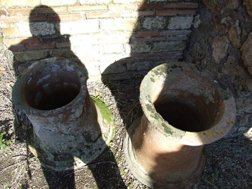 IX.9.12 Pompeii. March 2009. Two terracotta puteals.