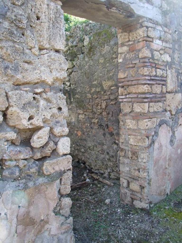 IX.9.13 Pompeii. March 2009. Doorway to Room 5, Cubiculum. Looking south from south passageway of garden.