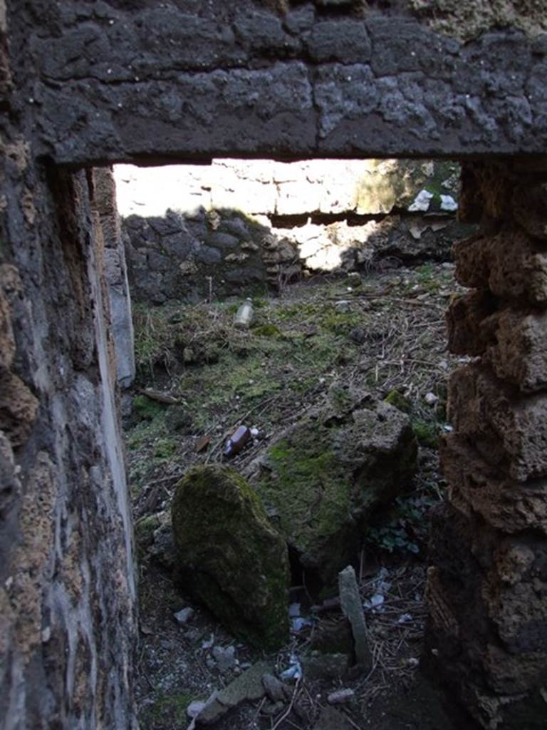 IX.9.13 Pompeii. March 2009. Room 8, Small room. Looking east through small doorway linking to Room 7.