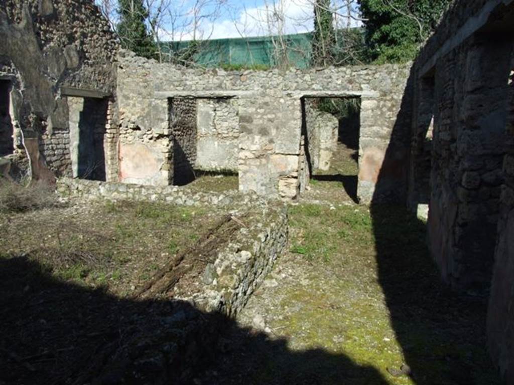 IX.9.13 Pompeii. March 2009. Looking east across south passageway of Room 6, Garden area. Looking towards entrance passageway.