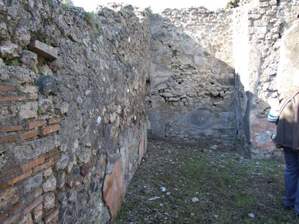IX.9.13 Pompeii. March 2009. Looking north along west side of Room 6, Garden, towards Room 10. Latrine.