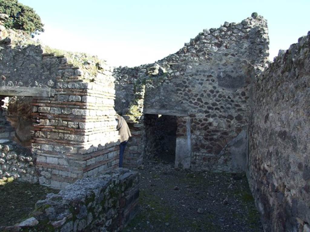 IX.9.a Pompeii. March 2009. Looking south along wide passageway to Kitchen and Latrine in south west corner.