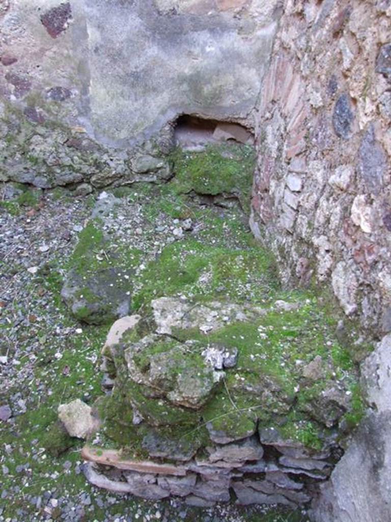 IX.9.a Pompeii. March 2009. North-west corner of kitchen, looking west across latrine.