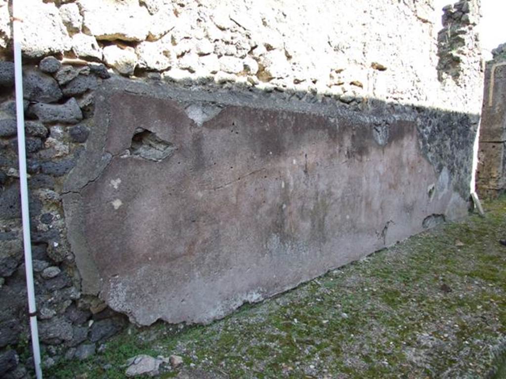 IX.9.c Pompeii.  March 2009.  Looking south.  Remains of plastered and painted street frontage between IX.9.c and IX.9.d
