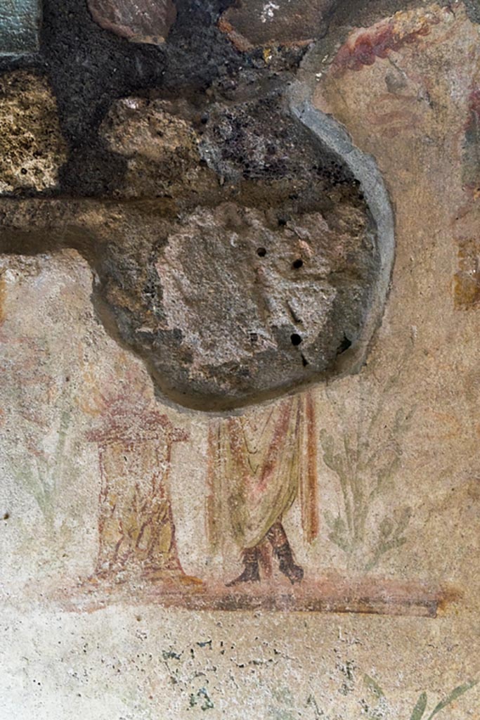 IX.9.c Pompeii. March 2023.
West wall of kitchen with remaining painting of Genius. Photo courtesy of Johannes Eber.