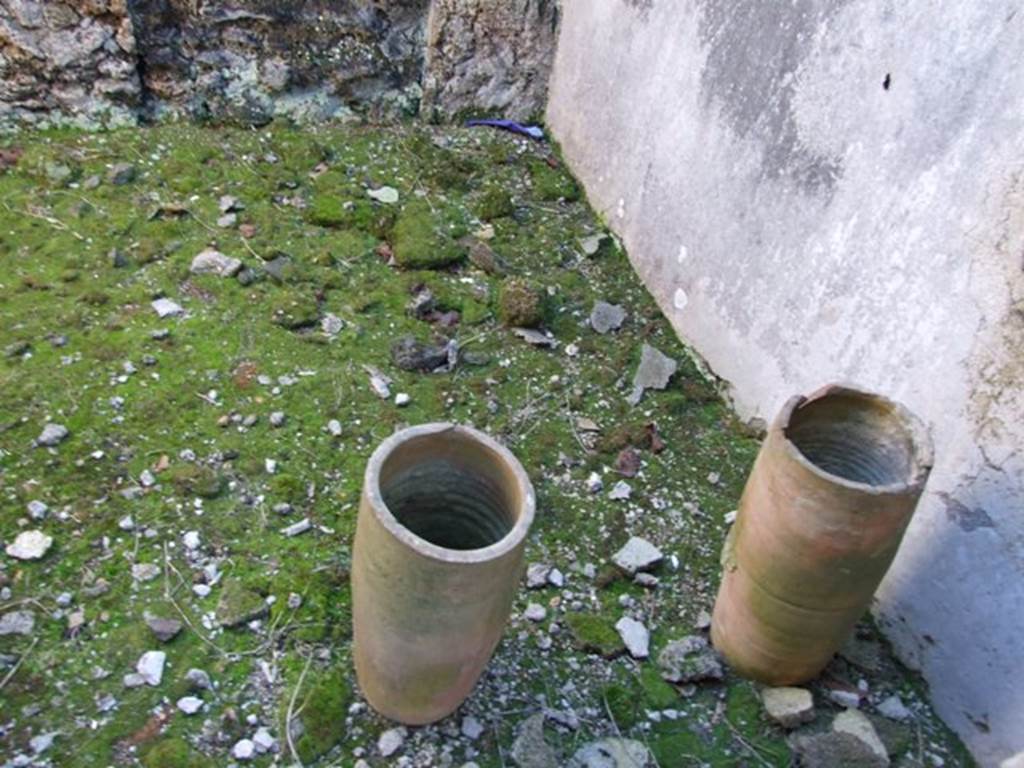 IX.9.d Pompeii. March 2009. Room g, terracotta down pipes in cubiculum.