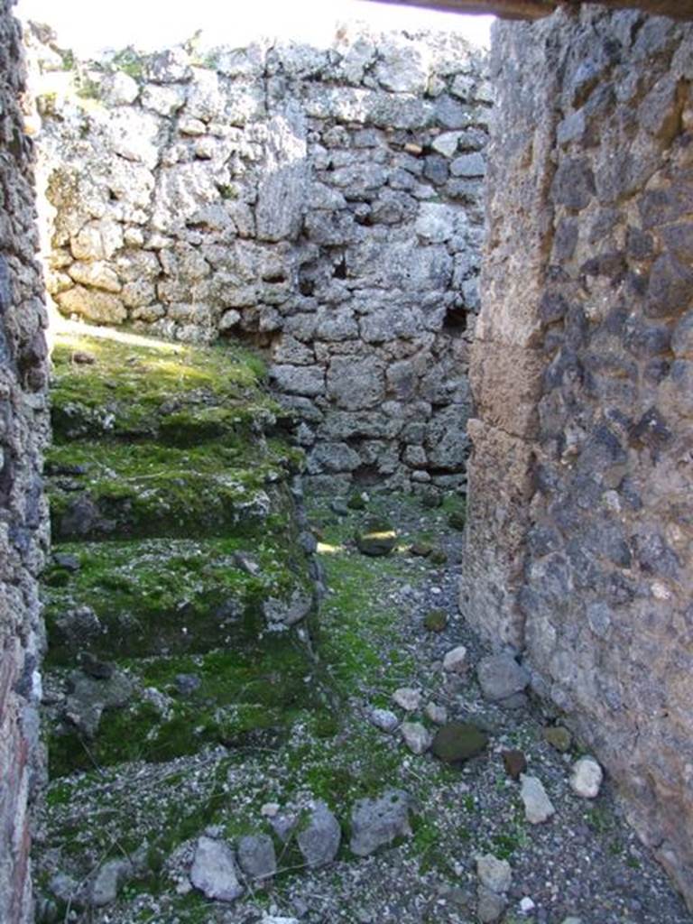 IX.9.d Pompeii. March 2009. Room h, stairs to upper floor, looking south.
The continuation for the wooden stairs can be just seen on the south wall.