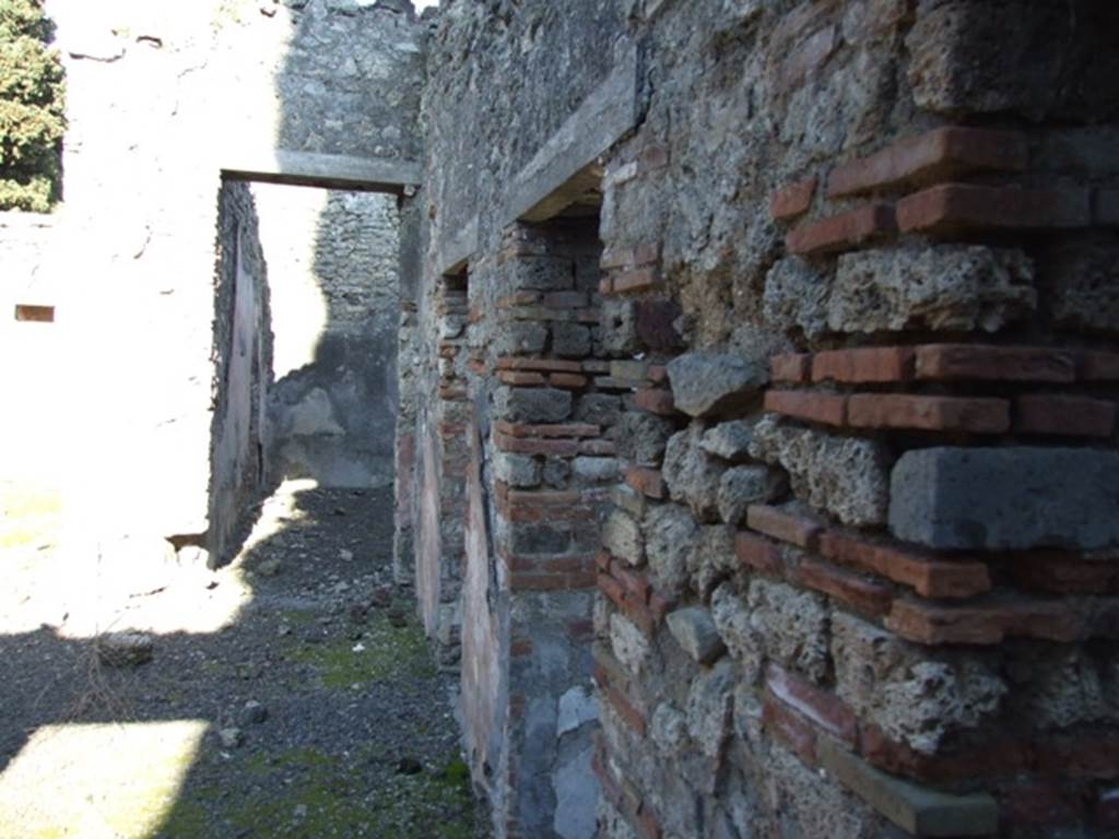 IX.9.d Pompeii. March 2009. Looking east along south side of atrium b.
Looking across doorways to rooms g and m, to room l, triclinium.