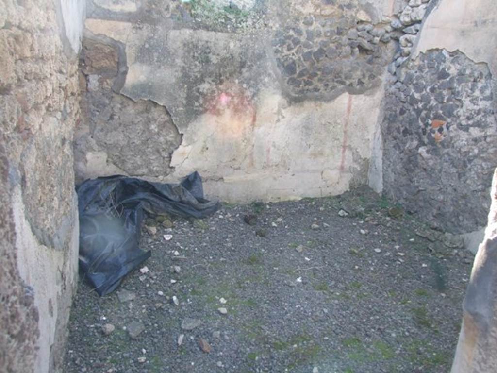 IX.9.d Pompeii. March 2009. Room c, west wall of cubiculum. According to NdS, the floor of the cubiculum was of signinum, and the walls were painted on a white background. In the panels on the walls, framed by red bands, were painted cupids. One held a dove or pigeon, another a rabbit, and the third pushing forward a piglet. In the south wall was the bed recess, and in the west wall there was a window at the top.
See Notizie degli Scavi, 1889, p.130