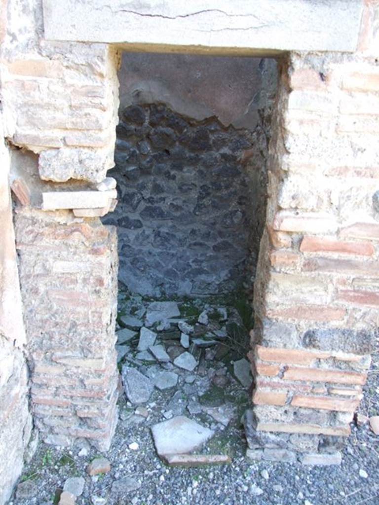 IX.9.d Pompeii. March 2009. Doorway to Room d. Cupboard in north west corner of atrium.