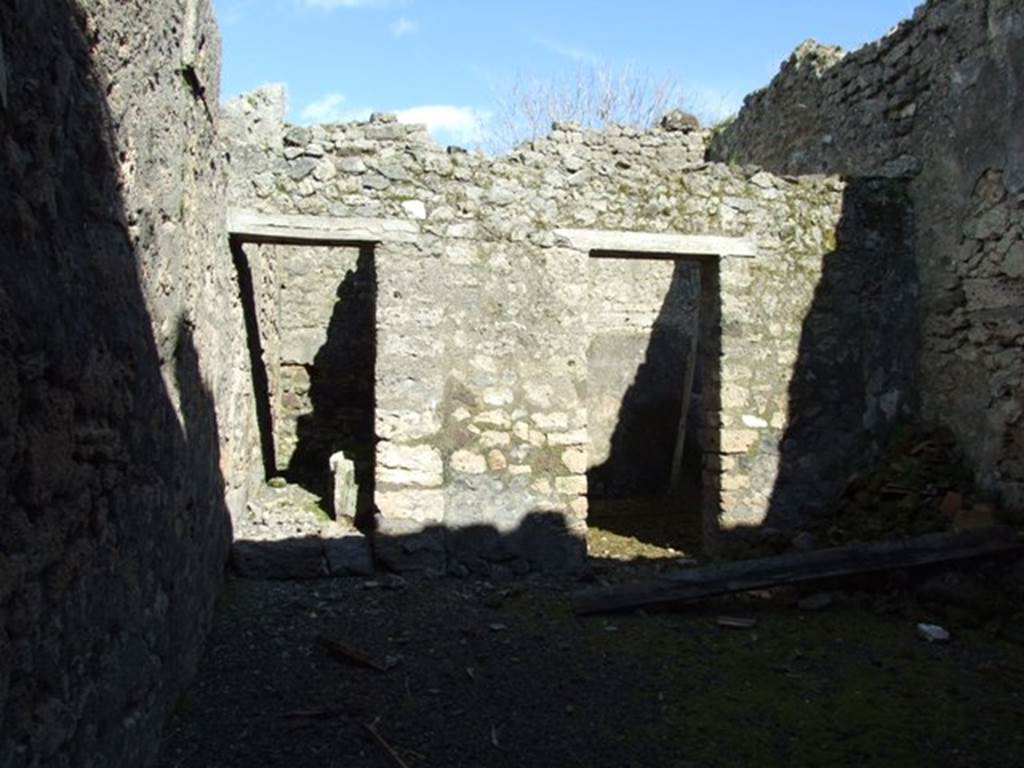 IX.9.f Pompeii. March 2009. Doorways on east side of atrium, to Staircase to upper floor, and Tablinum (or Triclinium?)