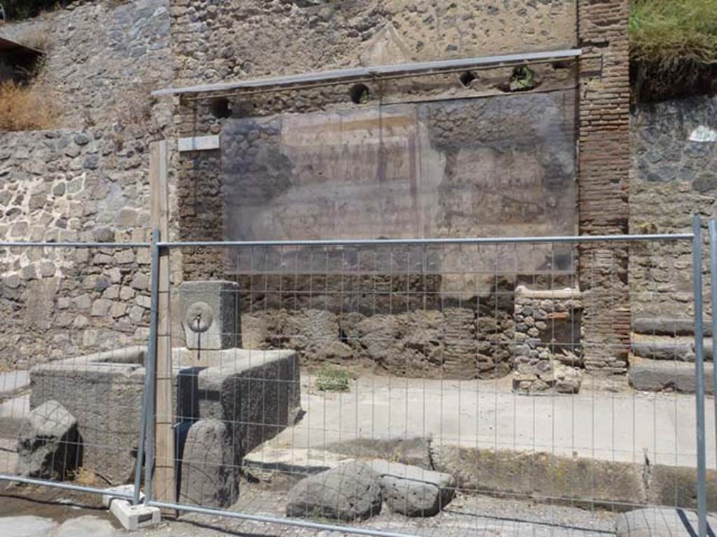 IX.11.1 Pompeii. June 2012. Photo courtesy of Michael Binns. North side of Via dell�Abbondanza, on the extreme left is the unexcavated roadway between IX.7 and IX.11.
On the extreme right is the entrance doorway to IX.11.1.
