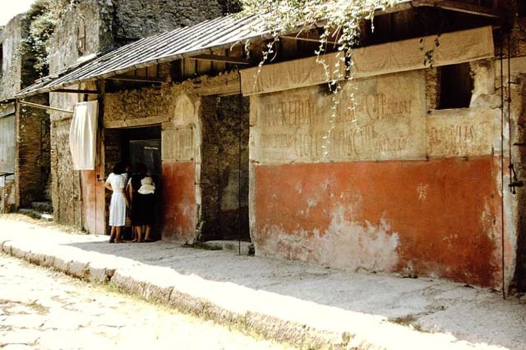 IX.11.3 Pompeii. 1959. Doorways to IX.11.1, IX.11.2 and IX.11.3 (centre), with graffiti.
Photo by Stanley A. Jashemski.
Source: The Wilhelmina and Stanley A. Jashemski archive in the University of Maryland Library, Special Collections (See collection page) and made available under the Creative Commons Attribution-Non Commercial License v.4. See Licence and use details.
J59f0516