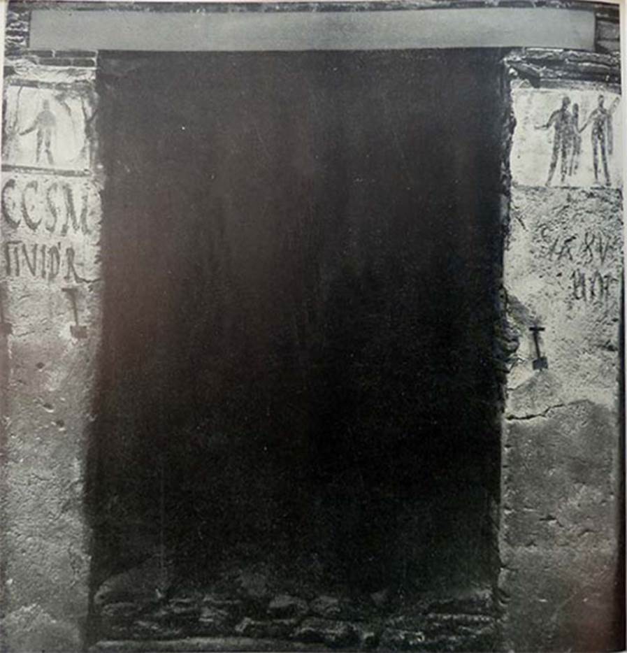 IX.11.7 Pompeii. Old excavation photo from 1912 or 1915. Entrance doorway with paintings and graffiti.
According to Boyce, (note, he allocated the number as being IX.IX.7) –
On each pilaster was a painting subsequently covered over by a new layer of whitewash (dealbatio) upon which a new painting was then done.
Of these four paintings three are known to us –
On the left pilaster, the earlier painting represented a poorly preserved male figure probably Hercules.
On the right pilaster, the earlier painting was of Minerva pouring a libation upon a burning altar (ara pulvinata); the later painting was of Hercules leading a pig adorned with a red band.
See Boyce G. K., 1937. Corpus of the Lararia of Pompeii. Rome: MAAR 14. (p.112, no.26).
According to Fröhlich,
Both pictures are on a white background and dark framed.
The left picture was covered by a younger, thin plaster, which fell off in the course of the excavation. Shown is a man seen from the front, naked except for a garment hanging from the left side of the body, which lowers the right arm in sacrifice and strains its right leg, perhaps Hercules.
In the right picture, gradually due to the progressive weathering, three successive phases came to light, whereby for some time the youngest and the middle phase, later the middle and the oldest, were to be seen together.
1. Youngest phase:
Hercules, naked except for the lion's skin over the left forearm, stands on his left leg, lowers his right arm in sacrificial position, carries the club in his left arm and with his left hand leads a small pig, in profile, with sacrificial bandage.
2. Middle phase:
Hercules, naked except for the lion's skin over the left shoulder, stands on his right side, lowers his right hand in sacrificial posture and holds in his left arm the club leaning against his shoulder.
3. Older phase:
Minerva in green and white chiton and outer coat, yellow-green on the outside and red on the inside, a golden helmet on her head, a gold shield on the right, her right leg on a brown plinth, leans her left hand on the lance and sacrifices from the lowered right over a brown round altar.
Whether the pictures refer to the narrow house entrance no. 7 or belong to the shop No. 5/6, and / or to the shop No. 8, must remain open.
Dating: The Minerva of the oldest phase is of Third Style. The other phases cannot be dated any further.
See Fröhlich, T., 1991. Lararien und Fassadenbilder in den Vesuvstädten. Mainz: von Zabern. (p.337, F68)
See Notizie degli Scavi, February 1912 (p.62-64) and Notizie degli Scavi, 11th February 1915, (p.284-285)