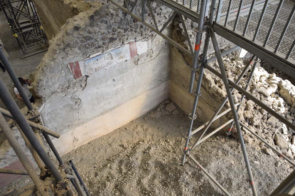 IX.12.4 Pompeii. February 2017. Room “f”. Photo courtesy of Johannes Eber.
Looking towards south-east corner of room being excavated, on west side of bakery at IX.12.6.
On the right side of the above photo, corridor/small room “g”, can be seen.
According to Spinazzola –
“The west and east walls (of the atrium “c”) were continuous, other than for a doorway in the east wall opening in the north-east corner (into room “g”).
Here was the wooden stairway rising to the upper floor, no less than 6.50m long by a height of 5m, roughly.”
See Spinazzola, V. Pompei, alla luce degli Scavi Nuovi di Via dell’Abbondanza (Anni 1910-1923), Vol.2, p.715-6.