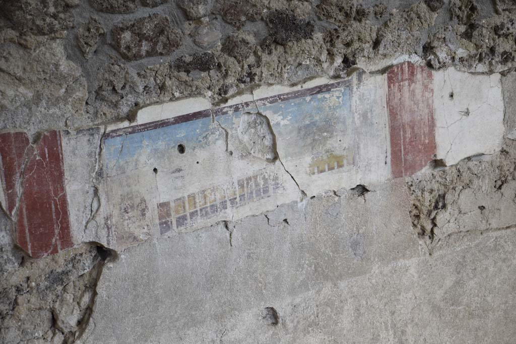 IX.12.4 Pompeii. February 2017.
Room “f”, detail of painted east wall in room being excavated, on west side of bakery at IX.12.6. Photo courtesy of Johannes Eber.
According to Spinazzola, this painting showing a house with two-storey porticoes and windows, was the decoration of a zoccolo in a room on the upper floor.
See Spinazzola, V. Pompei, alla luce degli Scavi Nuovi di Via dell’Abbondanza (Anni 1910-1923), Vol.2, p.719, fig.690.
